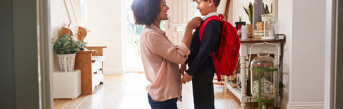 mother getting child ready for school
